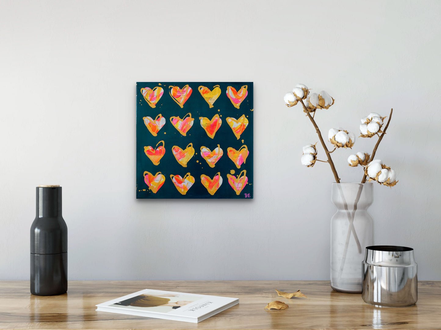 Maraschino Delight: Original Mixed Media Artwork with Vintage Cookbook and Hearts from Bridget Edwards Studio on light grey wall with vase and cotton bolls